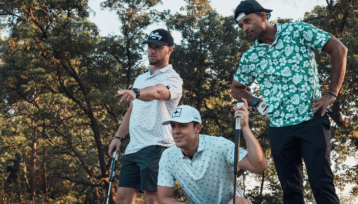 Three golfers enjoy the green range views at the top 12 nationally ranked Whitewater Wisconsin 9-hole Par 3 golf course greens at Spring Creek Golf Center