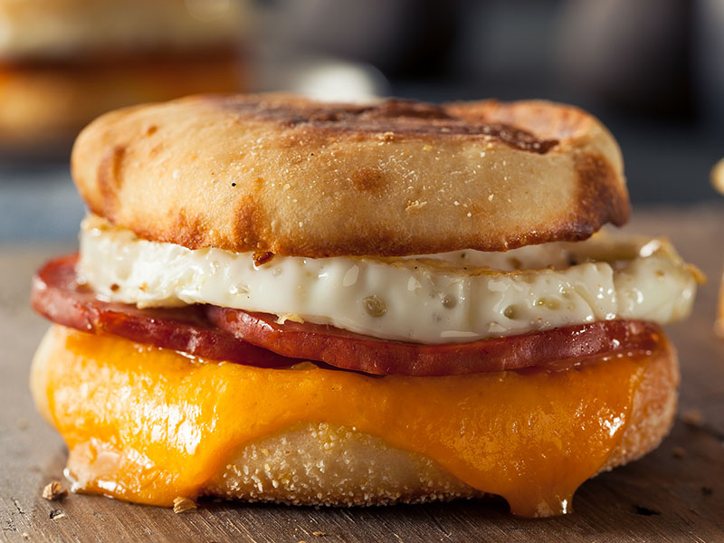 Breakfast sandwich on english muffin with egg, bacon and cheese is available for breakfast served all day at the restaurant at Spring Creek Golf Center.